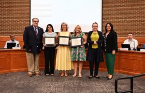 A group of teachers receiving awards